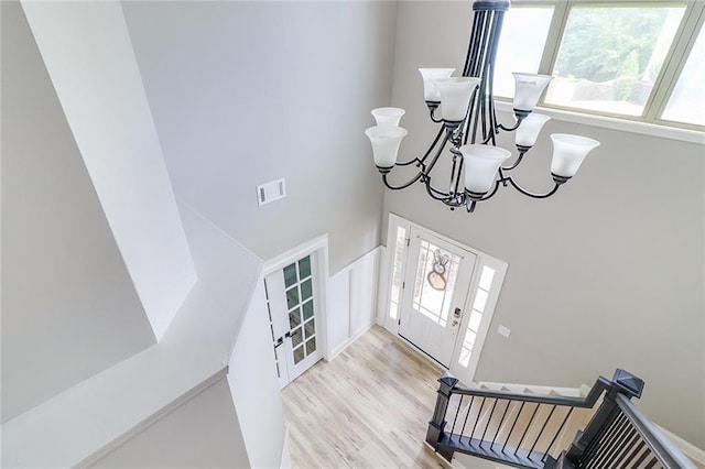95 Jeffco Dr, Jefferson, GA 30549 - entryway featuring a chandelier, a towering ceiling, light wood-type flooring, and french doors