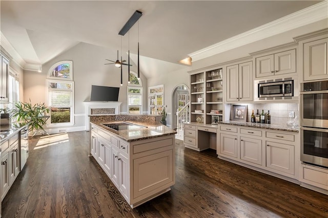 kitchen featuring a ceiling fan, stainless steel appliances, dark wood-style floors, and lofted ceiling