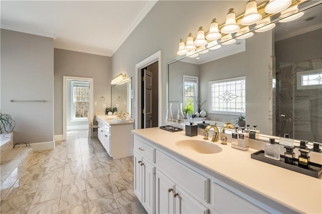 bathroom featuring marble finish floor, crown molding, a healthy amount of sunlight, and a shower stall