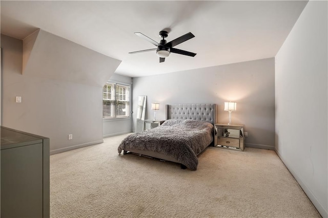 carpeted bedroom with baseboards and a ceiling fan