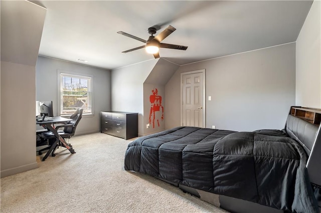 bedroom with visible vents, baseboards, light colored carpet, and ceiling fan