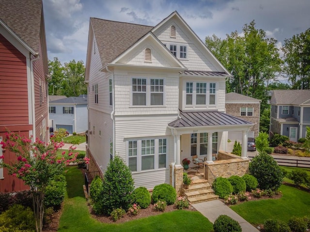 view of front of house with a porch and a garage