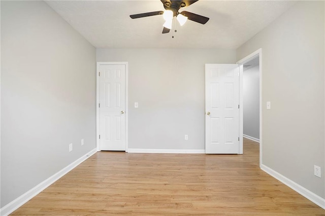 unfurnished bedroom with light wood finished floors and baseboards