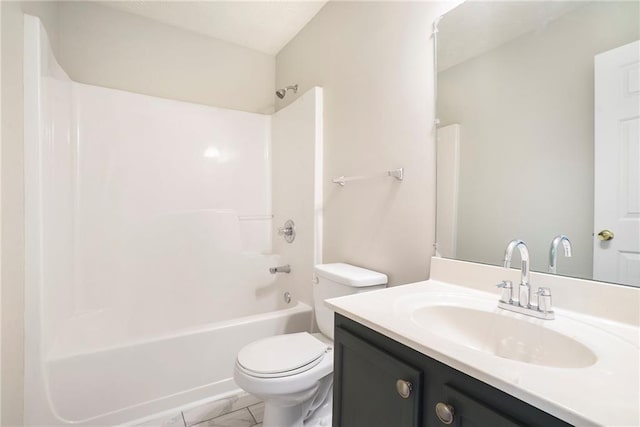 bathroom with toilet, marble finish floor, shower / bathing tub combination, and vanity