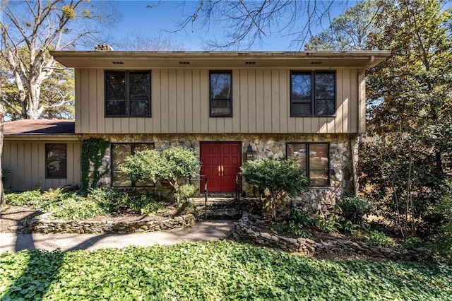 view of front of property with stone siding and board and batten siding