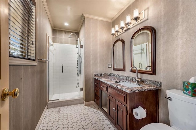 full bathroom with a stall shower, toilet, vanity, and ornamental molding