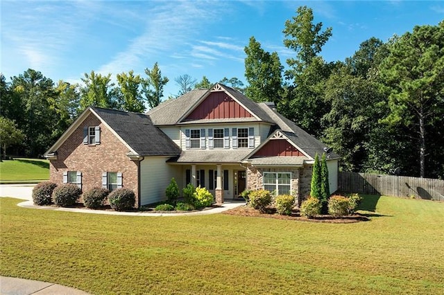 craftsman inspired home with a front lawn