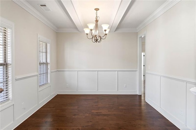 unfurnished dining area with dark hardwood / wood-style flooring, crown molding, and an inviting chandelier