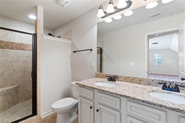 bathroom with toilet, a shower with door, and vanity