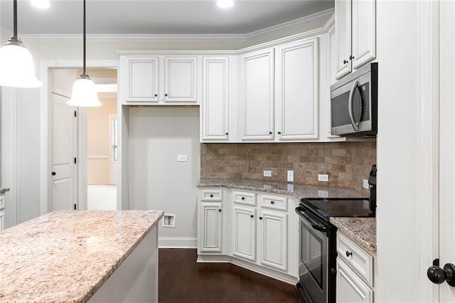 kitchen with hanging light fixtures, white cabinets, tasteful backsplash, light stone counters, and stainless steel appliances