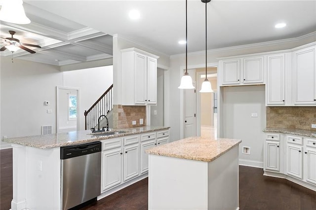 kitchen featuring sink, white cabinetry, a center island, and dishwasher