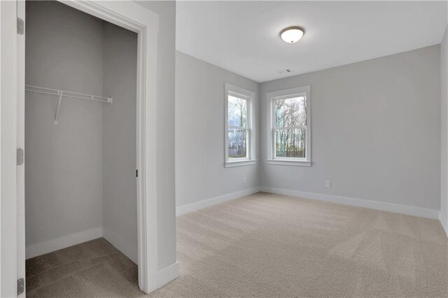 kitchen featuring premium range hood, crown molding, light hardwood / wood-style flooring, and appliances with stainless steel finishes