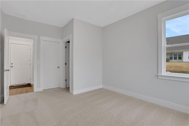 unfurnished bedroom featuring carpet