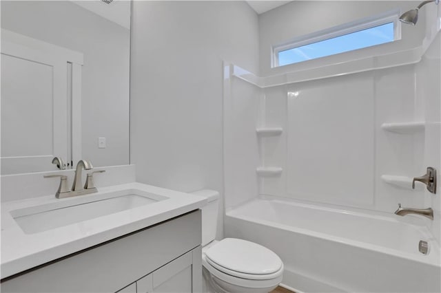 full bathroom with vanity,  shower combination, and toilet