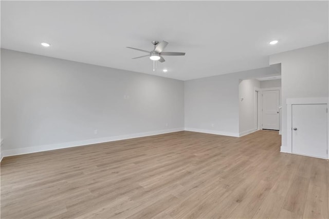 spare room featuring ceiling fan and light wood-type flooring