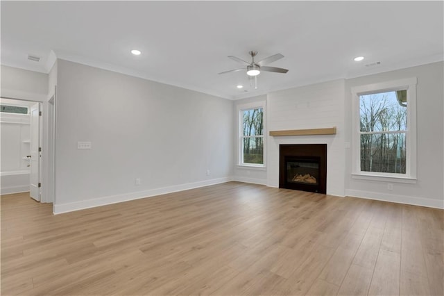 unfurnished living room with ceiling fan, light wood-type flooring, and ornamental molding