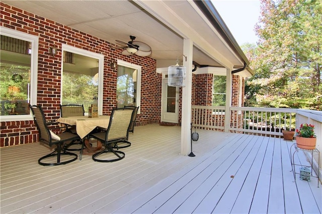 wooden terrace featuring ceiling fan