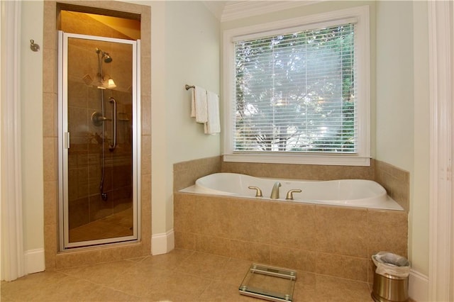 bathroom featuring shower with separate bathtub, tile patterned flooring, and a wealth of natural light