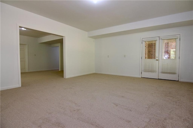 carpeted empty room featuring french doors