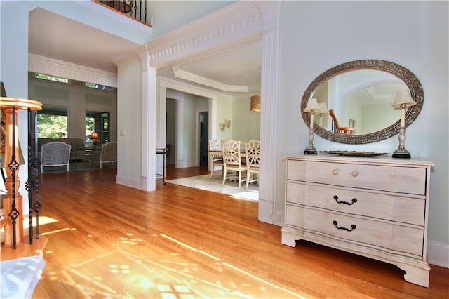 interior space with crown molding and wood-type flooring