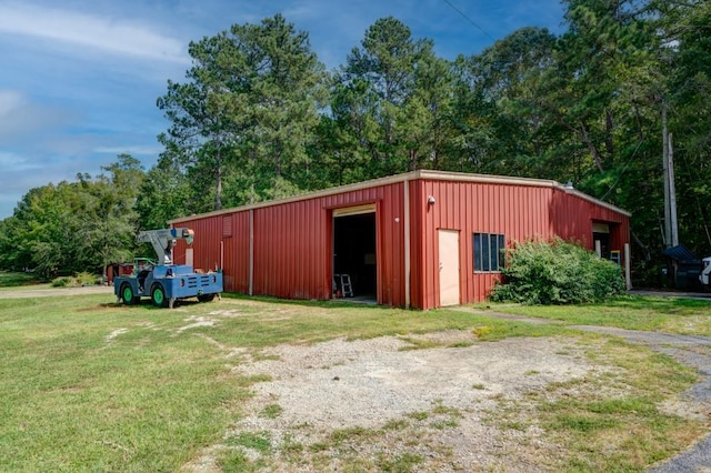 view of pole building with a lawn