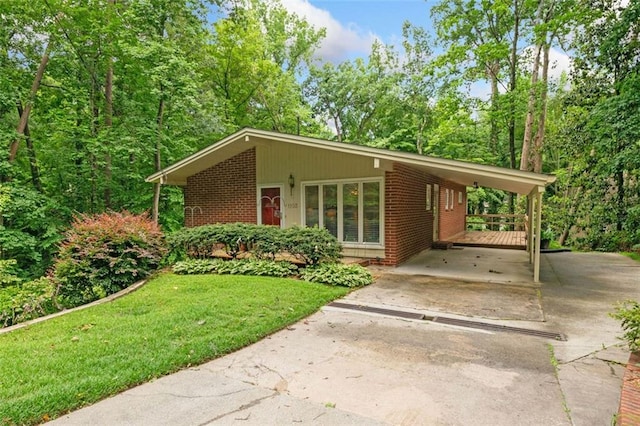 1103 Lee Cir NE, Atlanta, GA 30324 - view of front of property featuring concrete driveway, brick siding, a front yard, and a carport