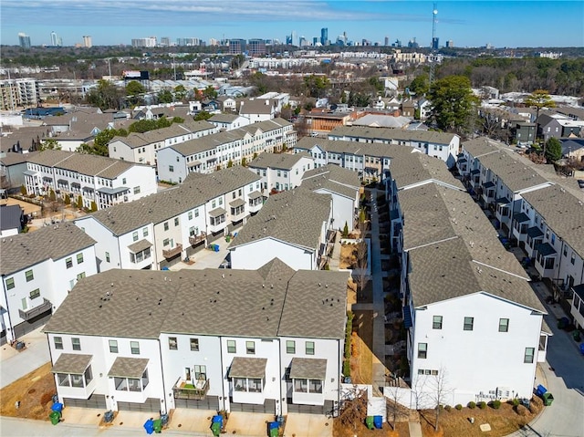 birds eye view of property with a residential view