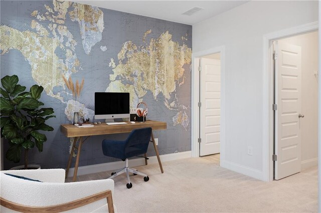 carpeted office with baseboards and visible vents