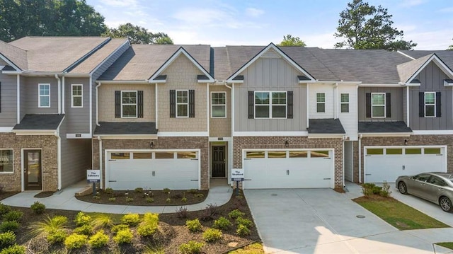 1410 Aura Ln, Lawrenceville, GA 30045 - townhome / multi-family property featuring board and batten siding, a garage, and concrete driveway