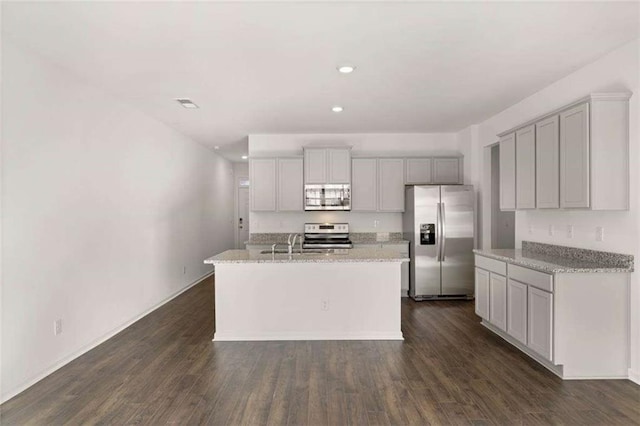 1410 Aura Ln, Lawrenceville, GA 30045 - kitchen featuring stainless steel appliances, dark wood-style flooring, a kitchen island with sink, recessed lighting, and gray cabinets