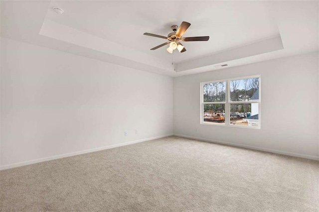 1410 Aura Ln, Lawrenceville, GA 30045 - carpeted empty room with a raised ceiling, ceiling fan, and baseboards