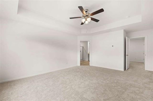 1410 Aura Ln, Lawrenceville, GA 30045 - unfurnished bedroom with carpet flooring, a raised ceiling, baseboards, and ceiling fan