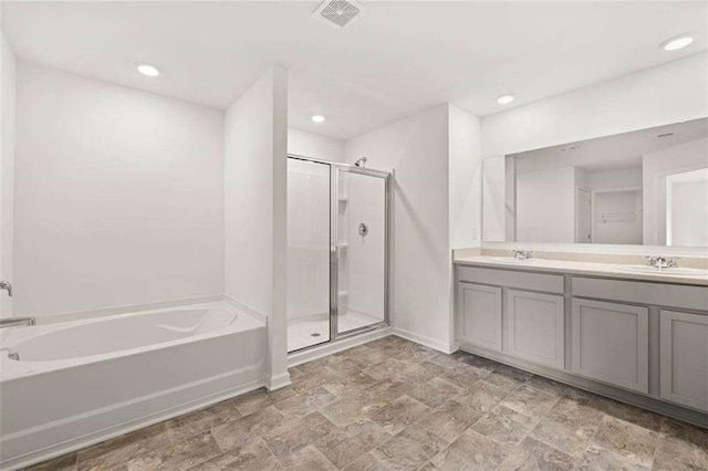 1410 Aura Ln, Lawrenceville, GA 30045 - bathroom with a garden tub, a shower stall, double vanity, baseboards, and recessed lighting