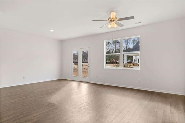 1410 Aura Ln, Lawrenceville, GA 30045 - unfurnished room featuring healthy amount of natural light, a ceiling fan, wood finished floors, and recessed lighting
