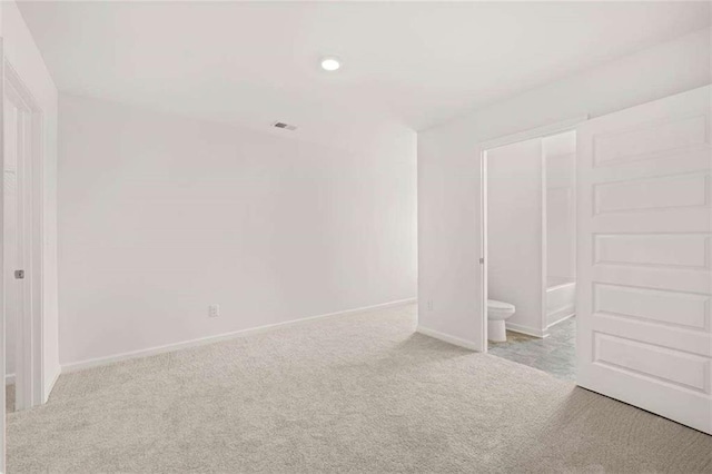 1410 Aura Ln, Lawrenceville, GA 30045 - unfurnished bedroom featuring carpet flooring, baseboards, recessed lighting, and ensuite bathroom