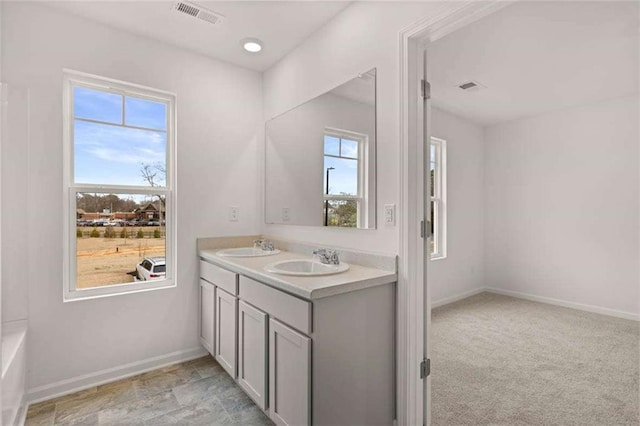 1410 Aura Ln, Lawrenceville, GA 30045 - full bath with plenty of natural light, double vanity, and baseboards