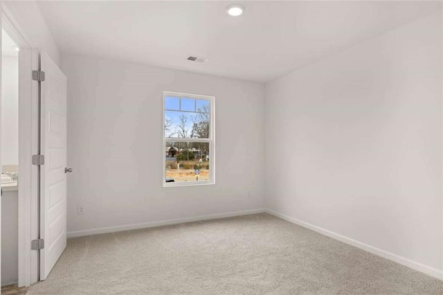 1410 Aura Ln, Lawrenceville, GA 30045 - unfurnished bedroom with light colored carpet, baseboards, and recessed lighting