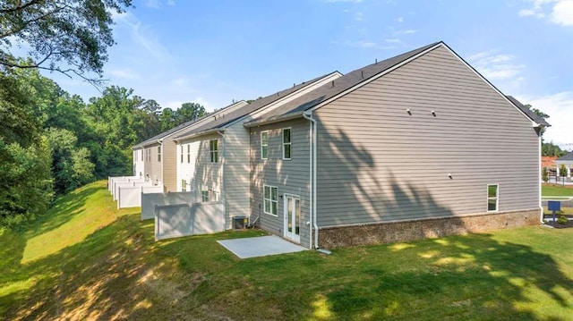 1410 Aura Ln, Lawrenceville, GA 30045 - view of side of home featuring a lawn and a patio area