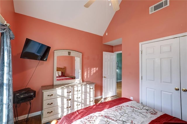 bedroom with ceiling fan, baseboards, high vaulted ceiling, and visible vents