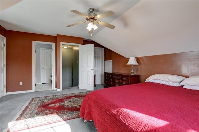 carpeted bedroom with baseboards, lofted ceiling, and ceiling fan