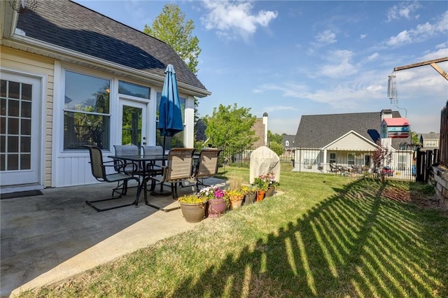 view of yard with a patio and outdoor dining space