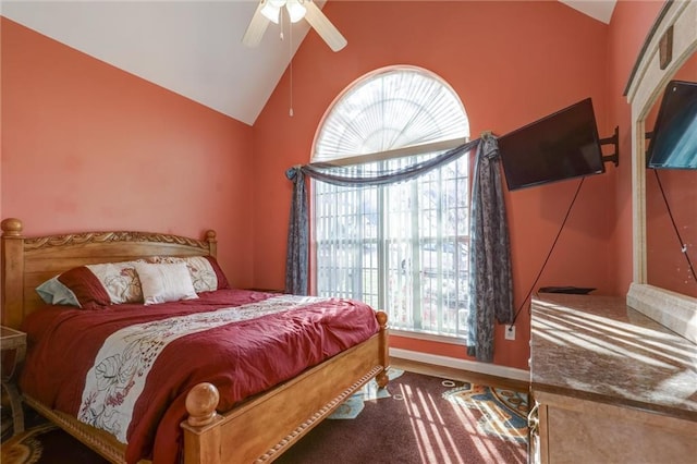 bedroom featuring ceiling fan and high vaulted ceiling