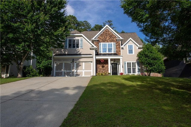 36 Evergreen Way, Dallas, GA 30157 - view of front of home featuring stone siding, a garage, concrete driveway, and a front lawn