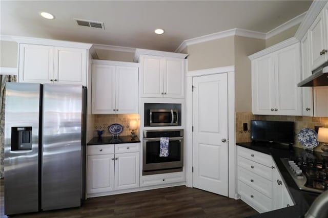 36 Evergreen Way, Dallas, GA 30157 - kitchen with appliances with stainless steel finishes, dark countertops, white cabinets, ornamental molding, and recessed lighting