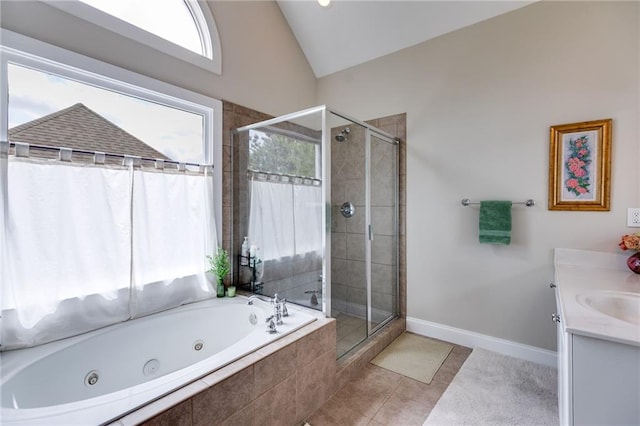 36 Evergreen Way, Dallas, GA 30157 - full bath with a stall shower, a whirlpool tub, vanity, lofted ceiling, and tile patterned floors