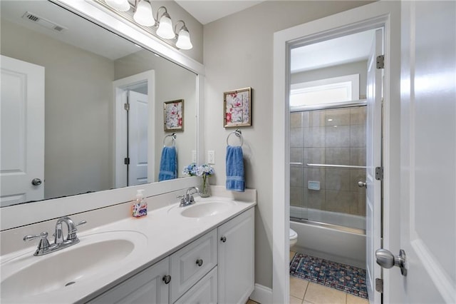 36 Evergreen Way, Dallas, GA 30157 - bathroom featuring double vanity, tile patterned floors, and enclosed tub / shower combo