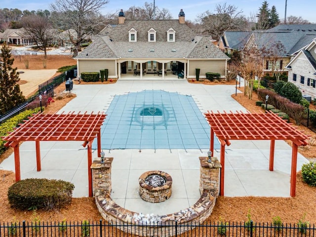 view of pool featuring an outdoor fire pit, a patio, and a pergola