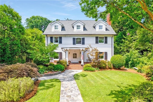 colonial-style house with a front yard