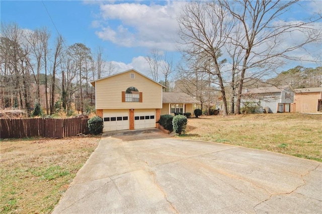 view of front of home with a front lawn, fence, concrete driveway, a garage, and brick siding