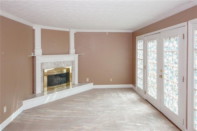 4161 Windermere Dr, Lithonia, GA 30038 - unfurnished living room with french doors, a fireplace, crown molding, and carpet